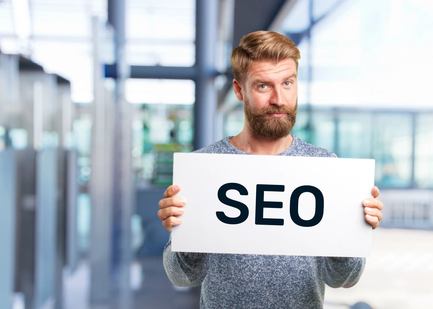 Man holding sign for SEO